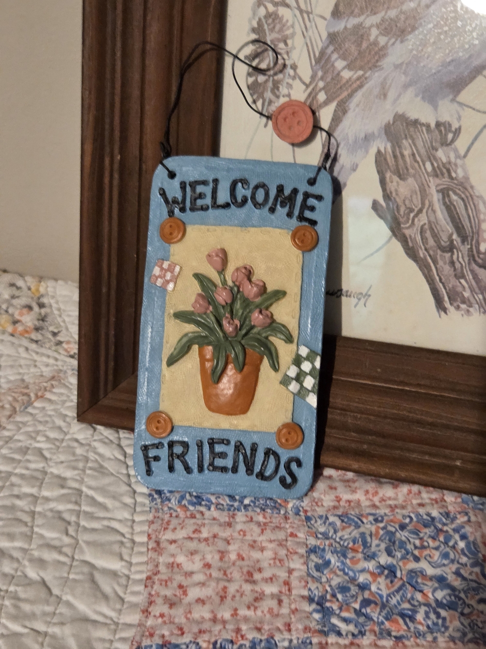Sweet little decor piece bright colors and potted plant reads welcome friends